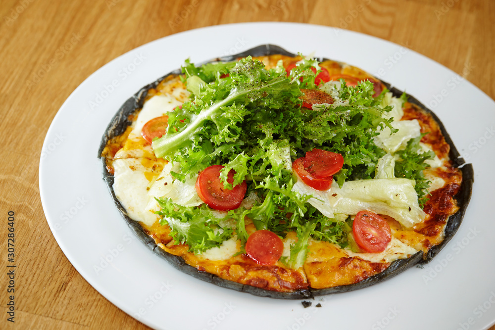 Black dough salad pizza with black pepper Black dough salad pizza with black pepper