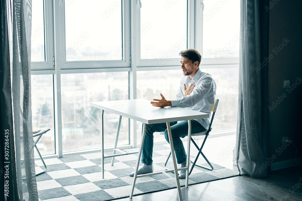businessman sitting on chair and looking at camera businessman sitting on chair and looking at camera