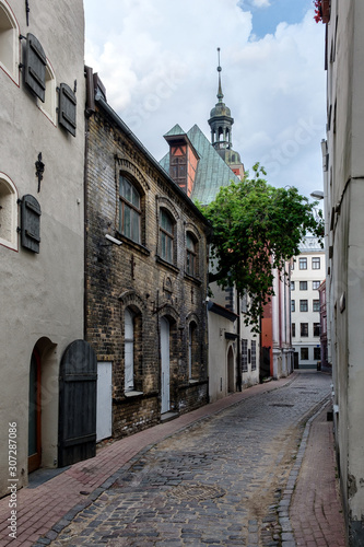 Narrow deserted street in the old town. Cathedral, Riga, Latvia.