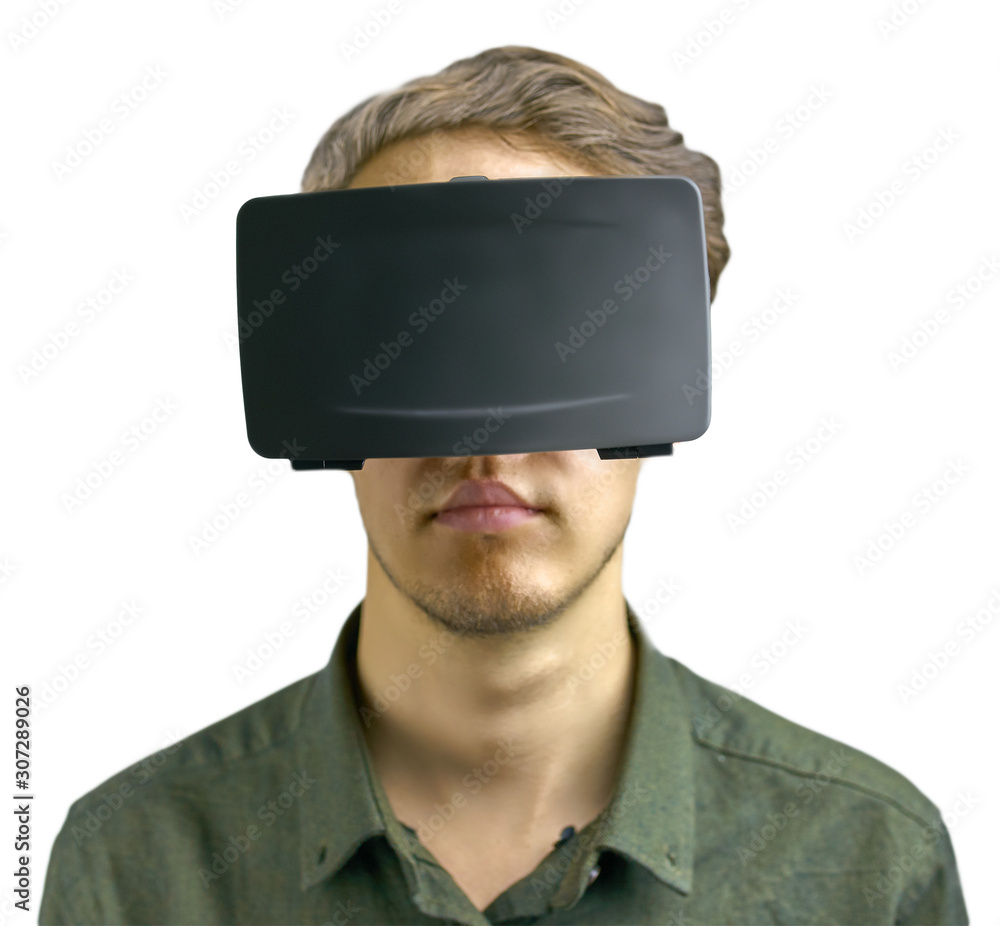 Young man in a shirt uses virtual reality glasses on the isolated white background Young man in a shirt uses virtual reality glasses on the isolated white background