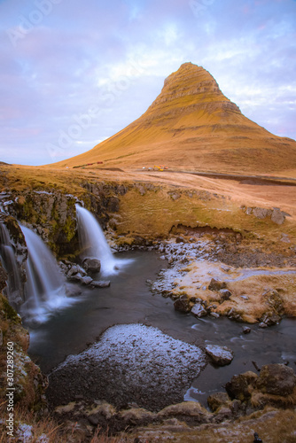 Beautiful scenery Kirkjufell mountain and Kirkjufellfoss waterfall as foreground in Iceland. © Jack
