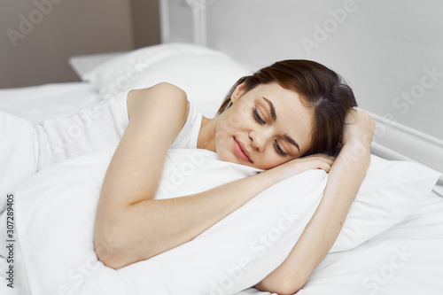 woman sleeping on her bed