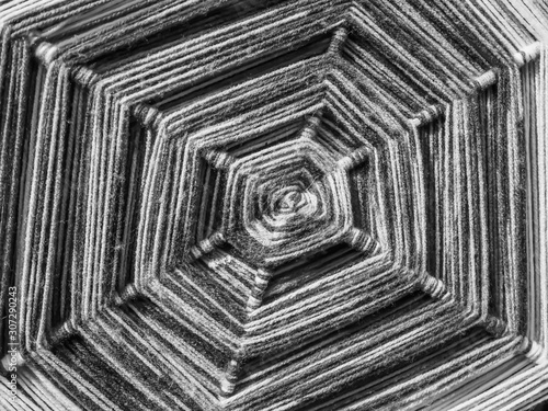 Abstract black and white tone of spiral octagon yarn pattern. Burst, handcraft, art, creativity texture and background concept and idea.