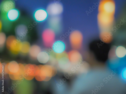 Abstract blurry man, multicolored colorful bokeh, garden and blue sky. Festival in the park or garden night lights, art, creativity, glittering pattern, texture and background concept and idea.