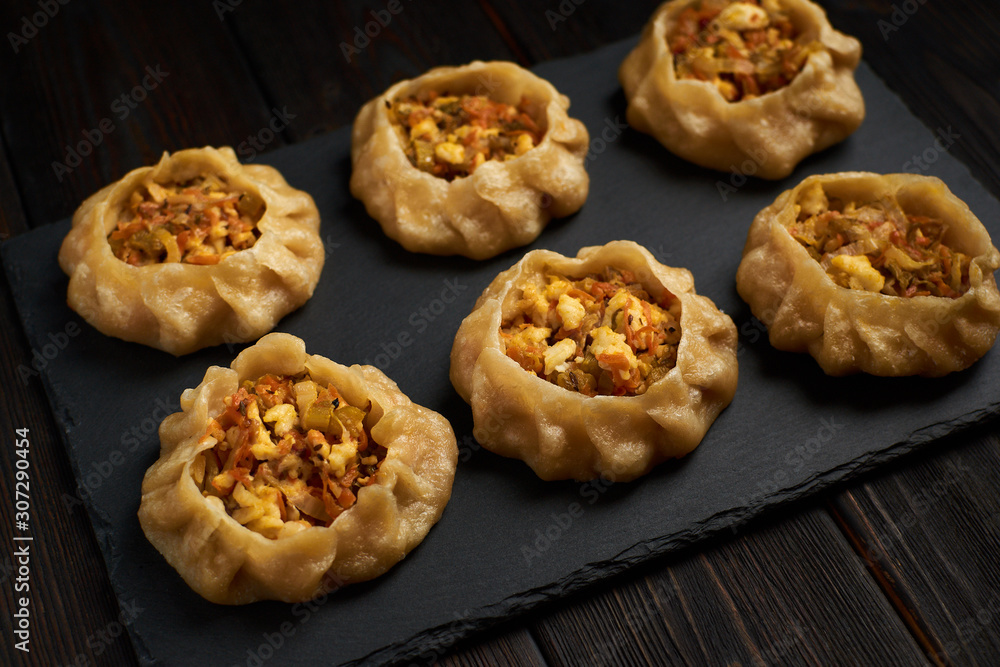 Dumplings with vegetable: Dimsum, Jiaozi, Momo, Ha Gao on dark wood background. Dumplings with vegetable: Dimsum, Jiaozi, Momo, Ha Gao on dark wood background.