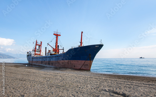фотографія Cargo ship aground on Anamur shore waiting for rescue
