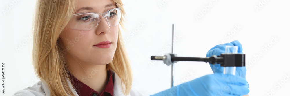 Technician hold in arms in protective gloves Technician hold in arms in protective gloves
