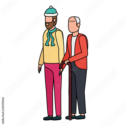 cute grandfather with young son using christmas hat