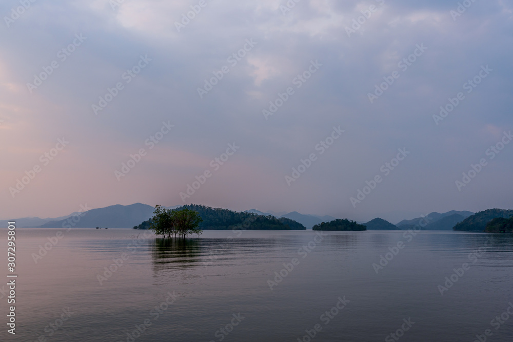 beautiful blue sky green forest mountains lake view at Kaeng Krachan National Park, Thailand.  an idea for backpacker hiking on long weekend or a couple, family activity camping holiday relaxing