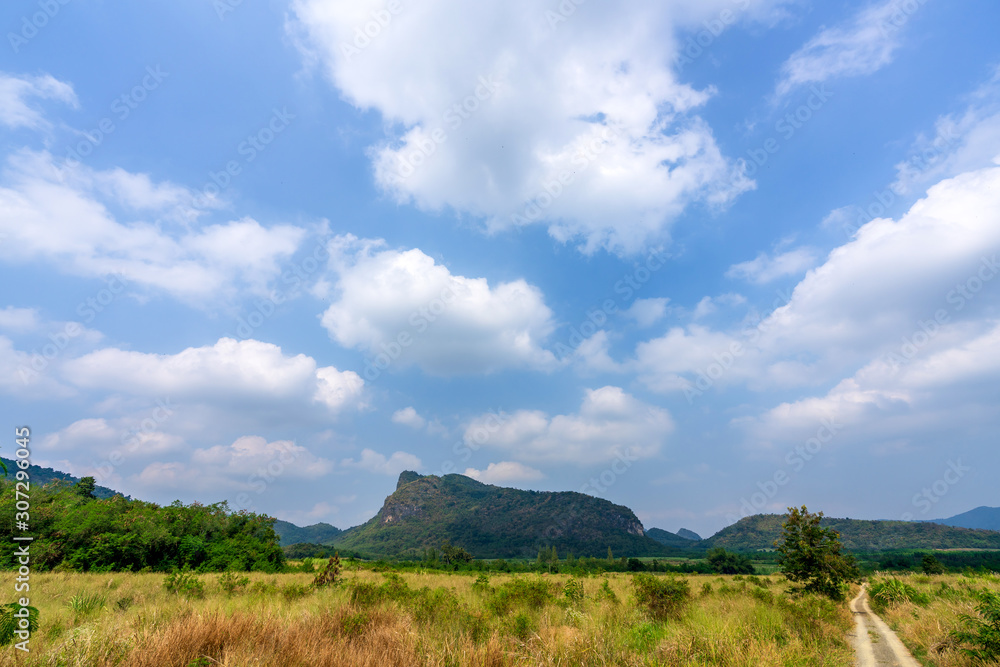 beautiful blue sky green forest mountains lake view at Kaeng Krachan National Park, Thailand.  an idea for backpacker hiking on long weekend or a couple, family activity camping holiday relaxing