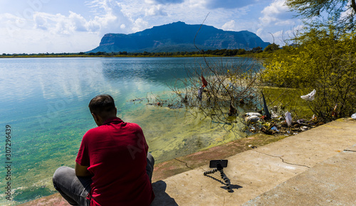 Young adult man at Vadatalav Lake also known as Pavagadh lake photo