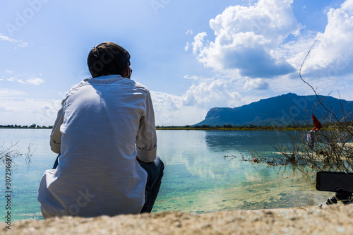 Young adult man at Vadatalav Lake also known as Pavagadh lake photo