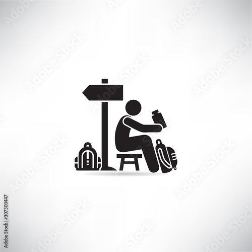 backpacker or traveler sitting and drinking near by road signage vector
