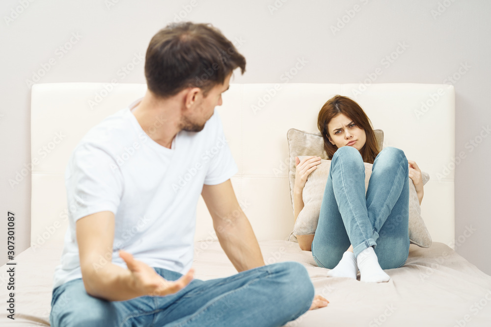 young couple sitting on sofa at home young couple sitting on sofa at home