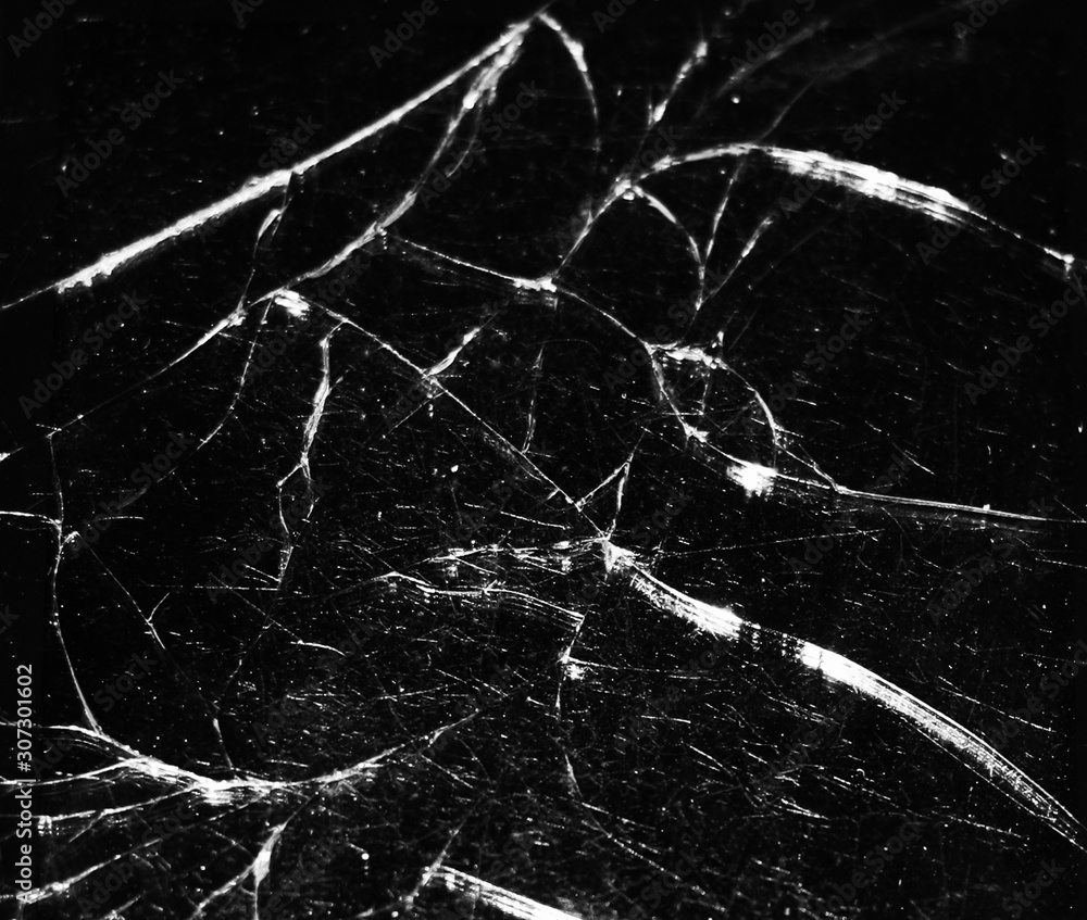Broken glass on a black background as a texture.