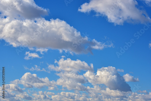 Clouds on a clear Sunny spring sky as a background