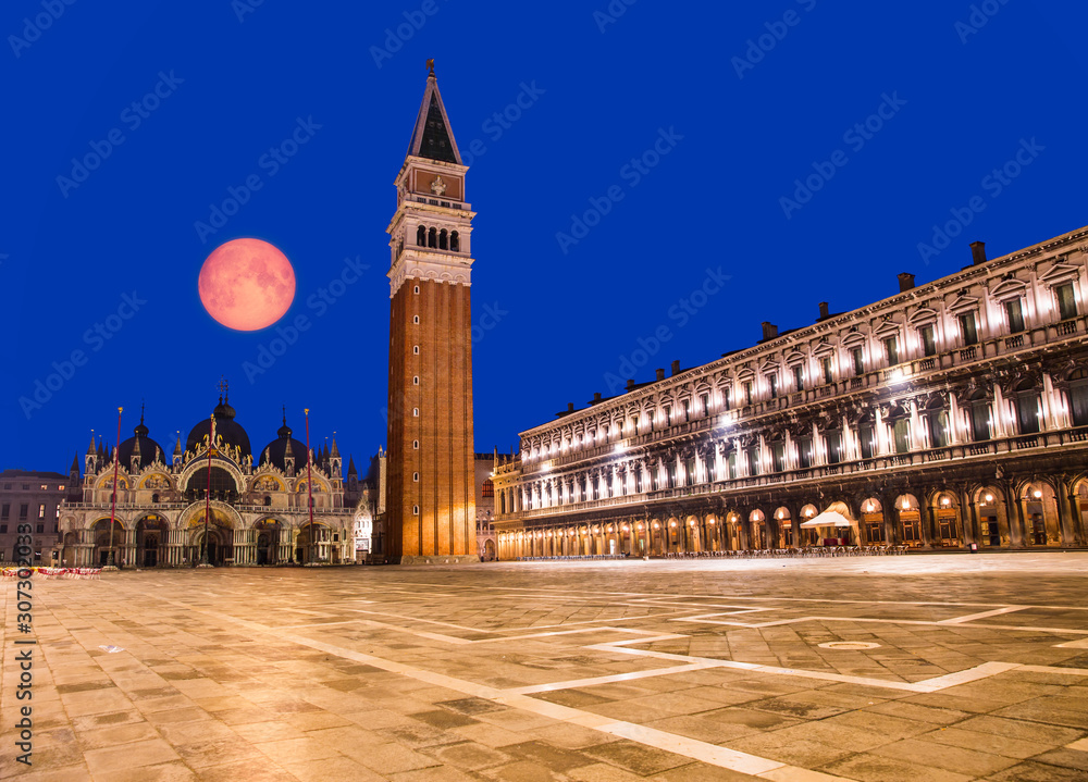 Piazza San Marco with the Basilica of Saint Mark and the bell tower of St Mark's Campanile with full moon 