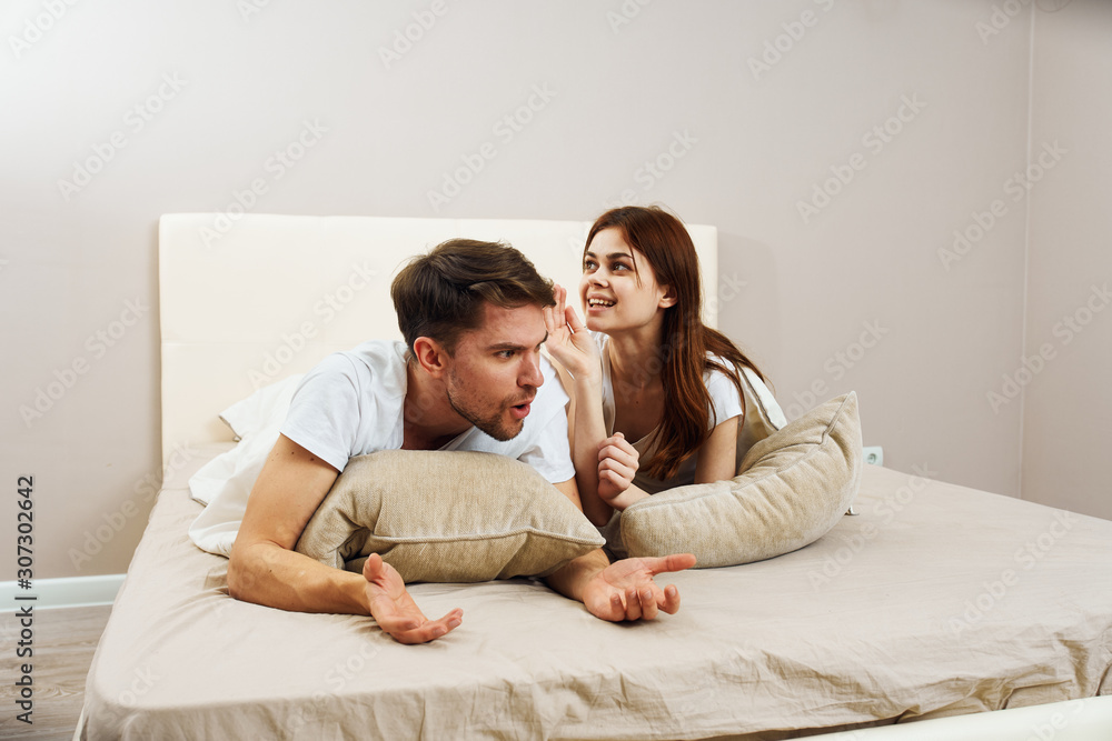 young couple sitting on sofa young couple sitting on sofa