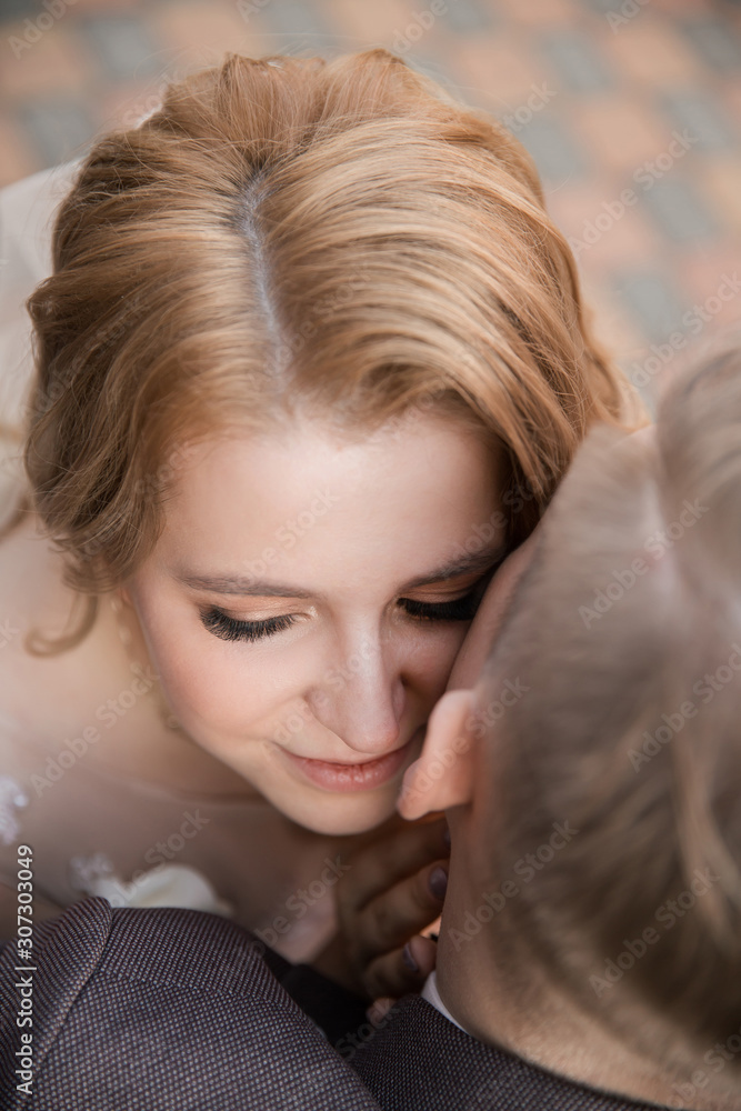 top view. happy bride and groom sitting on a bench top view. happy bride and groom sitting on a bench