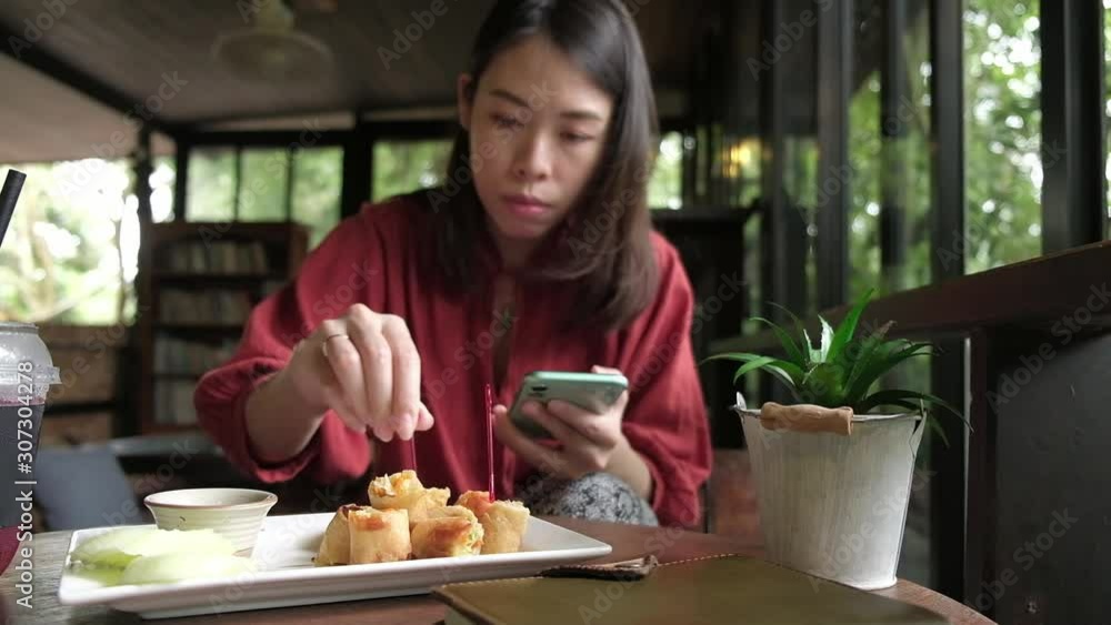 Young woman having breakfast in coffee shop. Young woman having breakfast in coffee shop.