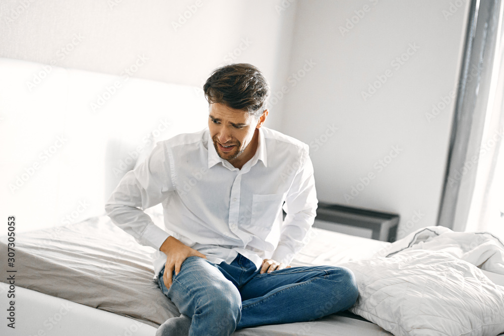 man sitting on sofa and using digital tablet man sitting on sofa and using digital tablet