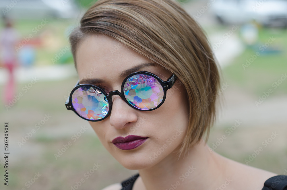 portrait of a Russian girl in designer glasses kaleidoscope, close-up  Stock-foto | Adobe Stock