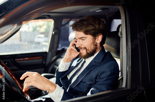 businessman talking on phone in car © SHOTPRIME STUDIO