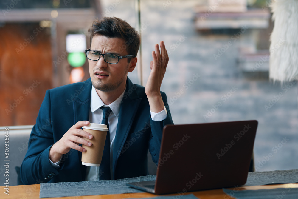 businessman working on laptop in cafe businessman working on laptop in cafe