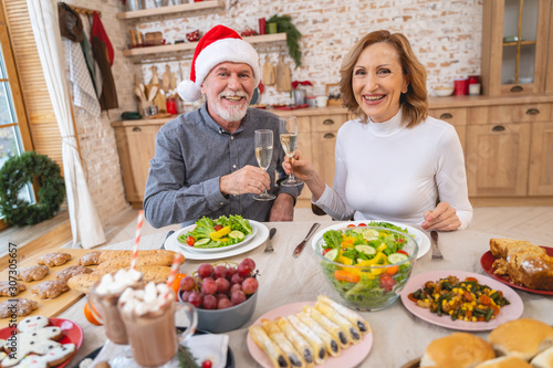 Attractive senior woman celebrating Christmas with her partner