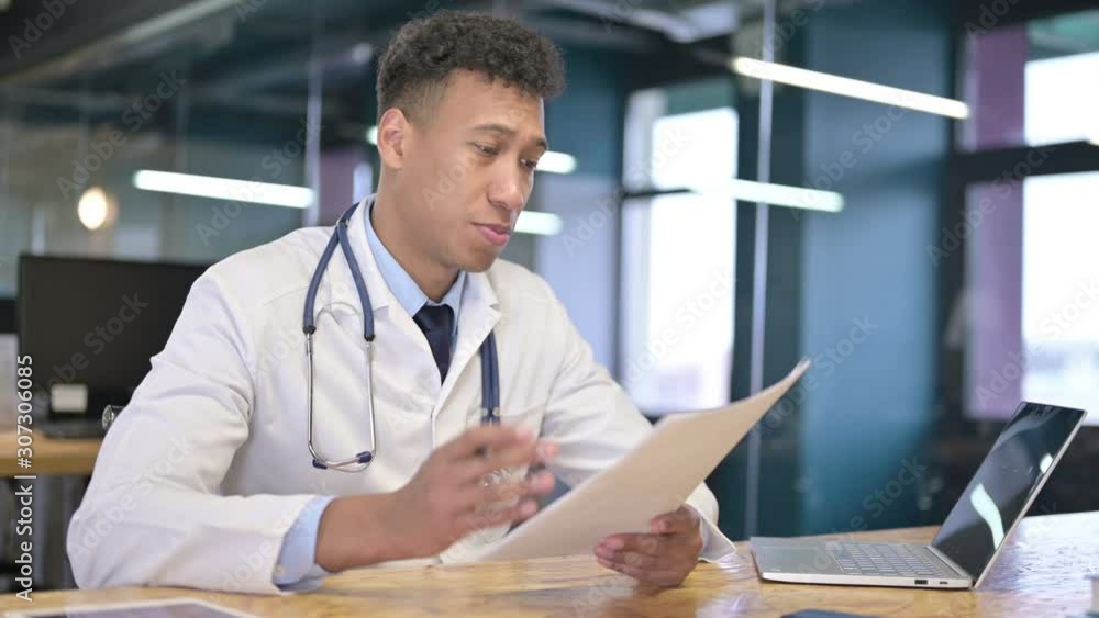 Cheerful Young Male Doctor Giving Documents to Client Cheerful Young Male Doctor Giving Documents to Client