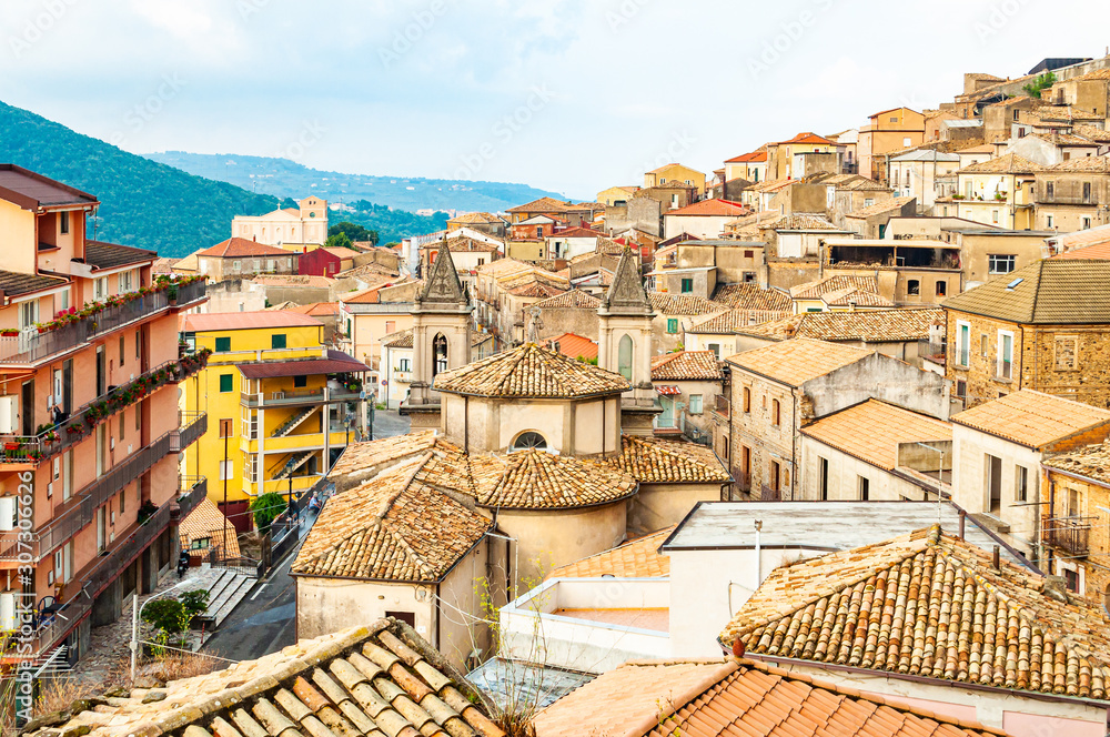 Traditional Italian village scenery. Cityscape of Curinga in Calabria, Italy. Medieval cityscape skyline of small southern Italian city located on evergreen forest mountains