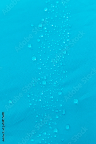 different drops of water on a blue background