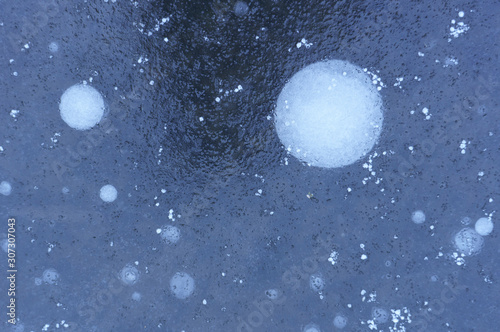 Ice texture with air bubbles, winter background