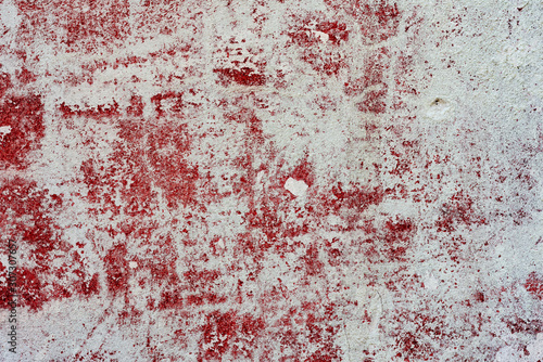 Texture of a concrete wall with cracks and scratches which can be used as a background