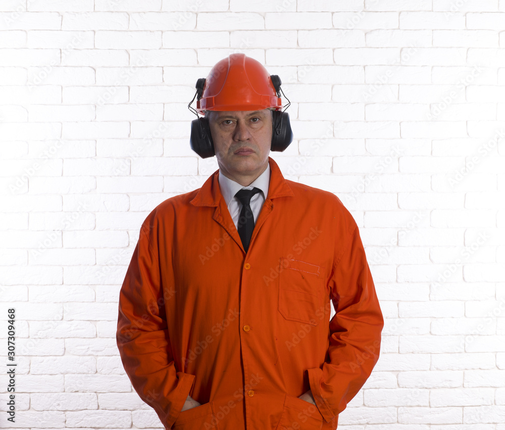 portrait of an engineer in orange special clothes portrait of an engineer in orange special clothes