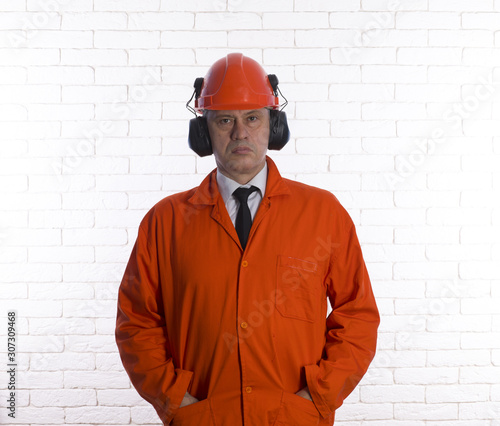 portrait of an engineer in orange special clothes © serikbaib