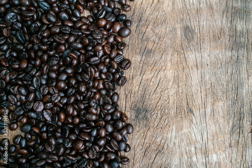 Roasted coffee bean flat lay on wood background