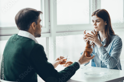 man and woman talking on cell phone