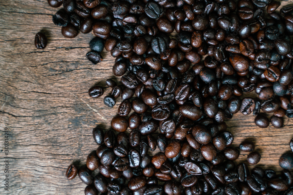 Roasted coffee bean flat lay on wood background Roasted coffee bean flat lay on wood background