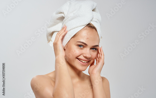 portrait of young woman with towel on her head