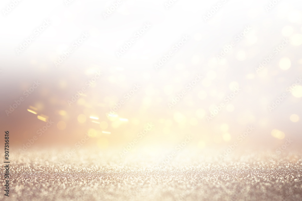Naklejka premium abstract background of glitter vintage lights . silver, gold and white. de-focused