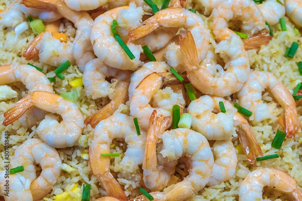 Shrimp fried rice and soy sauce with shrimp on top in the pan to make it look appetizing at the local market. Shrimp fried rice and soy sauce with shrimp on top in the pan to make it look appetizing at the local market.