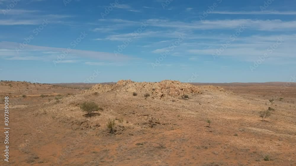 Slowly passing over the dry and desolate earth in outback Australia Slowly passing over the dry and desolate earth in outback Australia