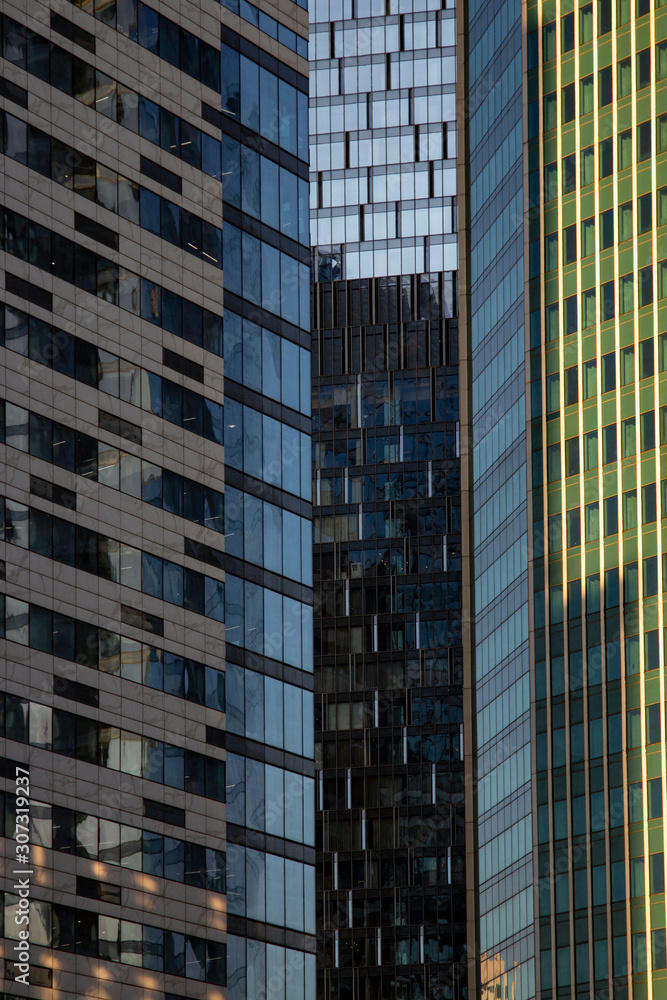 Modern skyscrapers in business district in evening light at sunset Modern skyscrapers in business district in evening light at sunset
