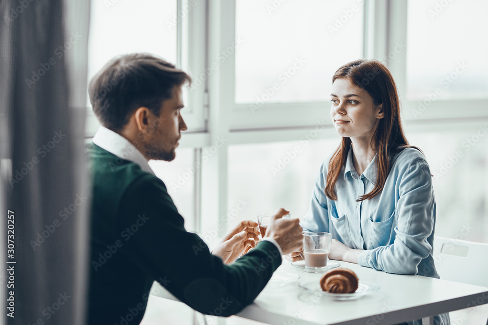 couple having breakfast in the kitchen couple having breakfast in the kitchen