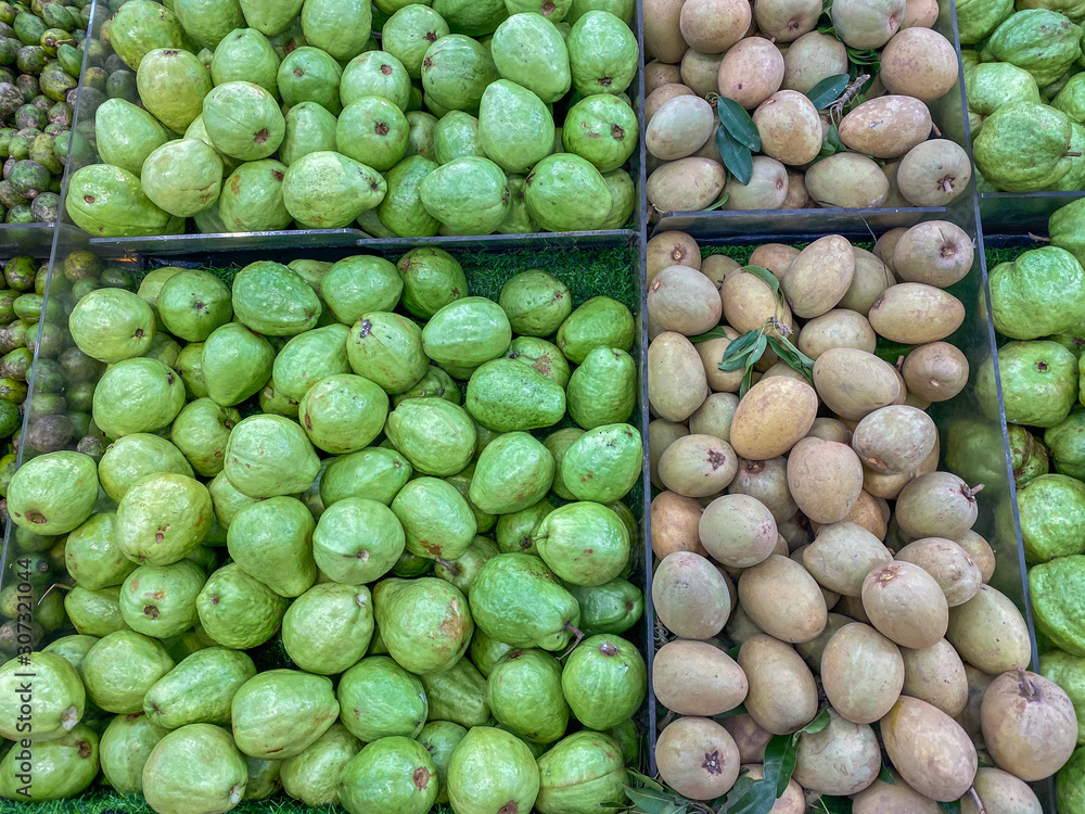 Big pile of guava and sapote fruit at famers' market Big pile of guava and sapote fruit at famers' market