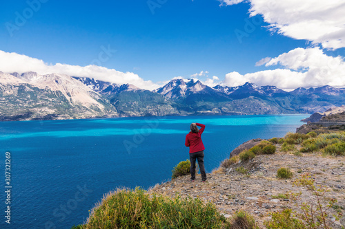 Woman tourist hiking, Chile travel, Bertran lake and mountains beautiful landscape, Chile, Patagonia, South America © Iuliia Sokolovska