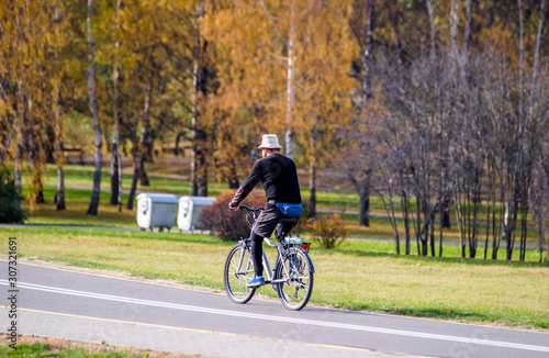Cyclist ride on the bike path in the city Park © licvin