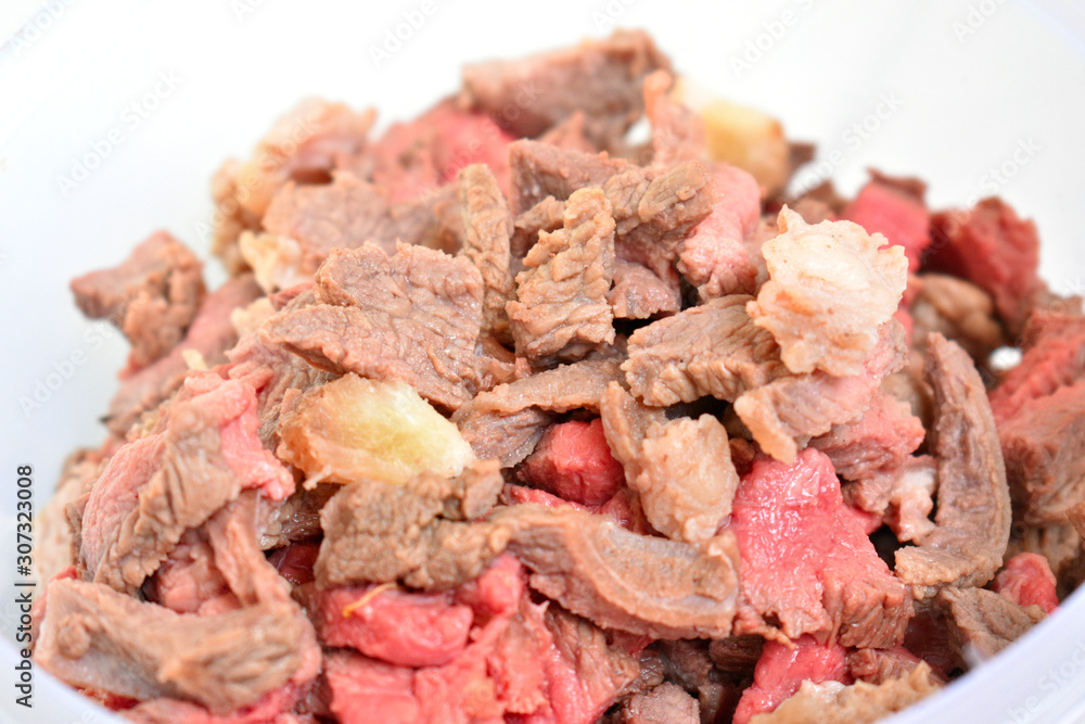 Boiled meat in white cup