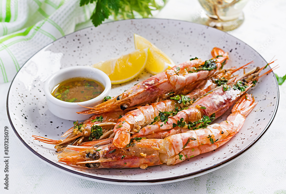 Grilled wild Argentinian red shrimps/prawns with parsley, oil, garlic and lemon. Delicious food. Keto / Paleo Diet. Grilled wild Argentinian red shrimps/prawns with parsley, oil, garlic and lemon. Delicious food. Keto / Paleo Diet.